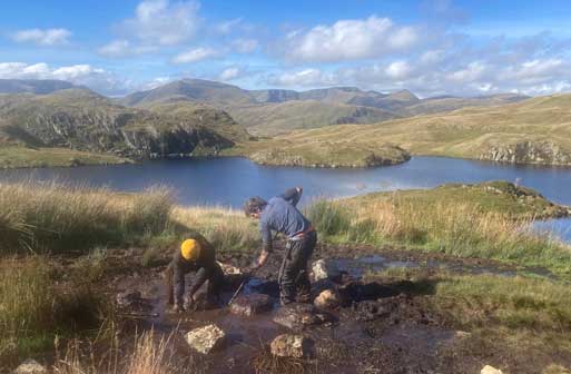 Rangers working in mud, Angle Tarn 2024